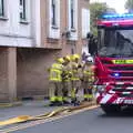 Firemen mill around, Fire and Water: The Burning of the Blackrock Centre, County Dublin, Ireland - 12th August 2017