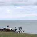 Someone reads a book on the clifftop, Fire and Water: The Burning of the Blackrock Centre, County Dublin, Ireland - 12th August 2017