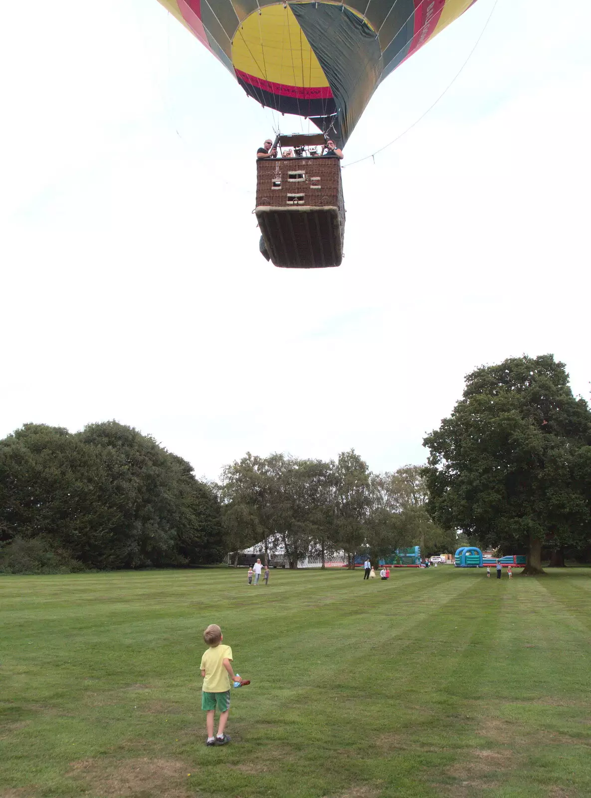 Harry watches as the balloon floats off, from The BSCC at Yaxley and the Hoxne Beer Festival, Suffolk - 31st August 2017