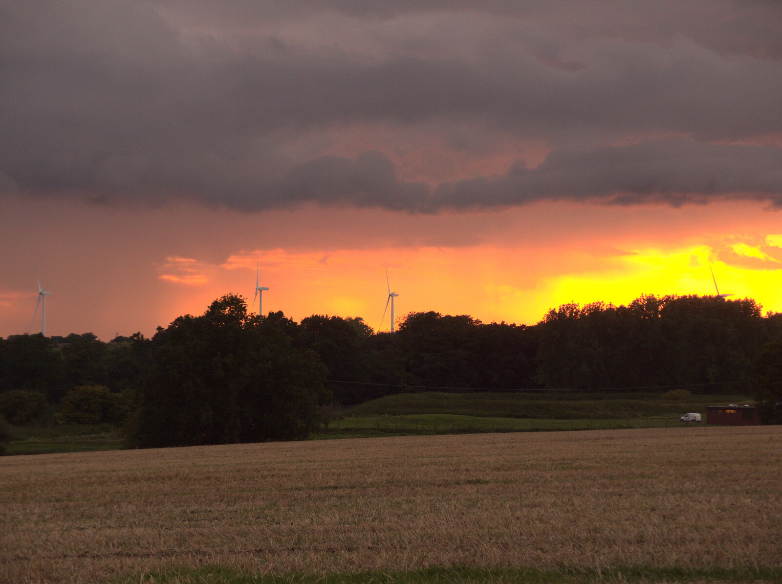 The BSCC at Yaxley and the Hoxne Beer Festival, Suffolk - 31st August 2017: Sunset, rain and wind turbines on the Denham road 