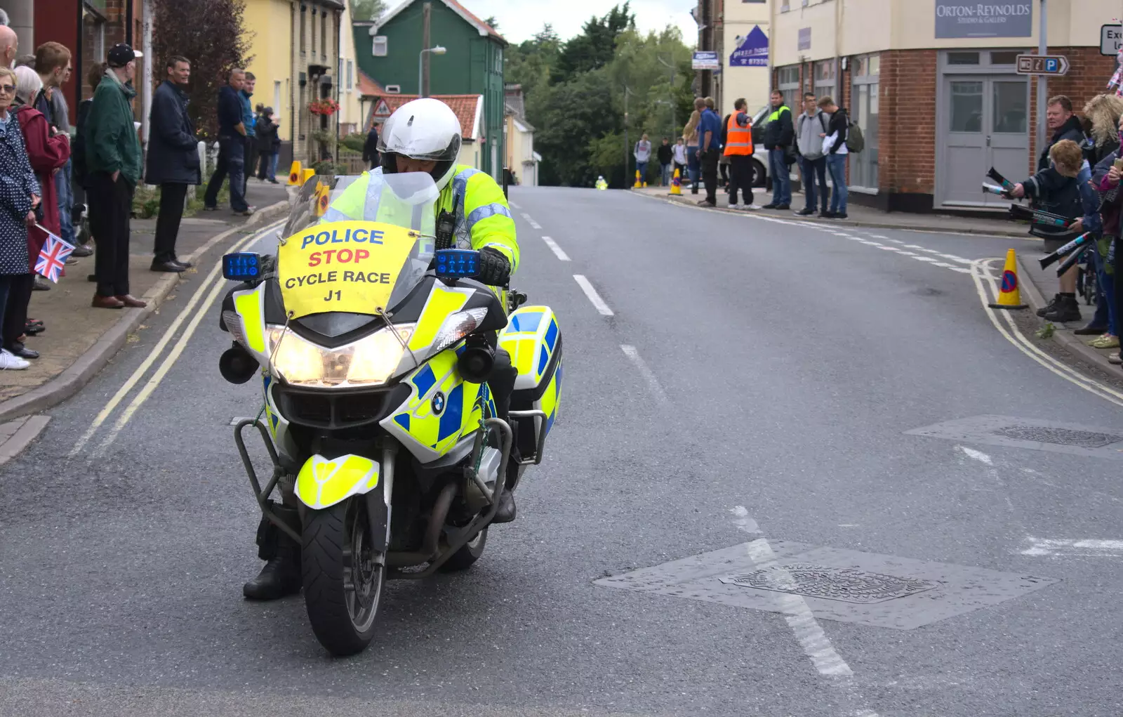 The first rozzer turns up as it kicks off, from The Tour of Britain Does Eye, Suffolk - 8th September 2017