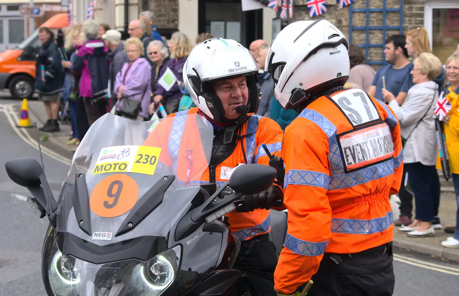 Two marshalls confer, from The Tour of Britain Does Eye, Suffolk - 8th September 2017