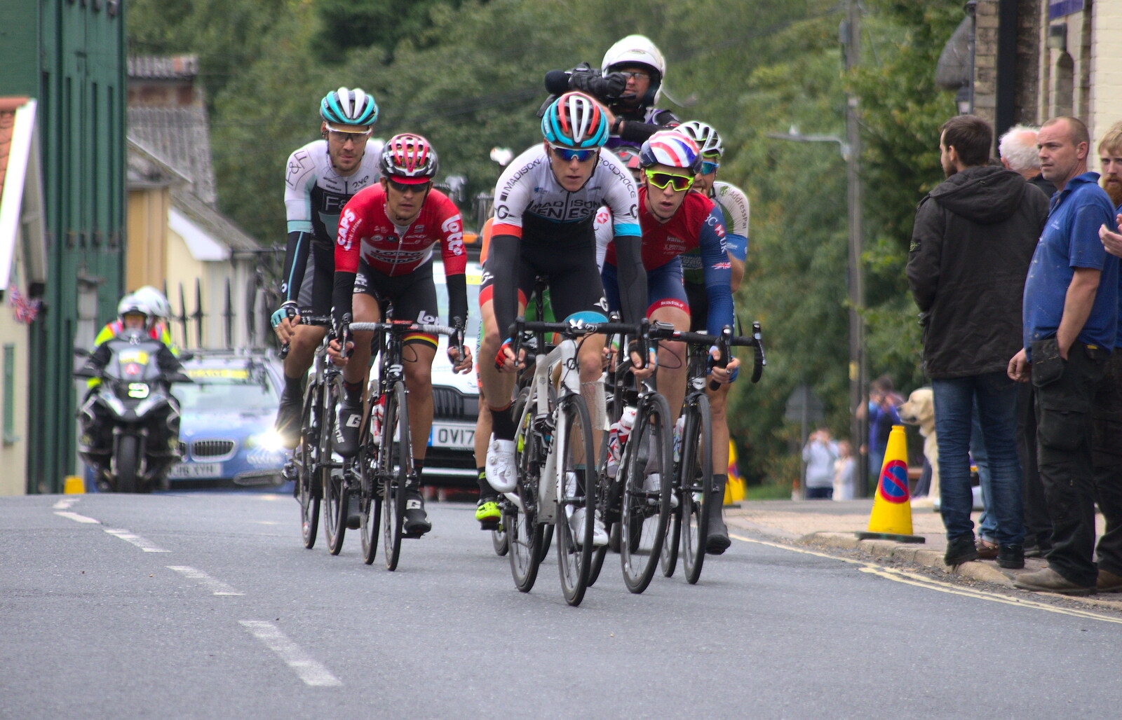 The lead peloton passes the chicken factory from The Tour of Britain Does Eye, Suffolk - 8th September 2017