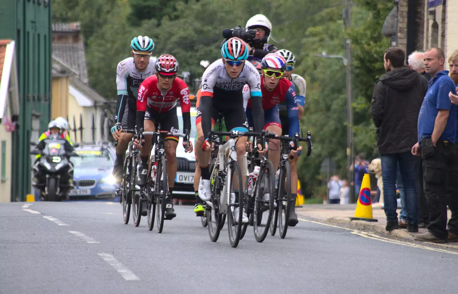 The lead peloton passes the chicken factory, from The Tour of Britain Does Eye, Suffolk - 8th September 2017