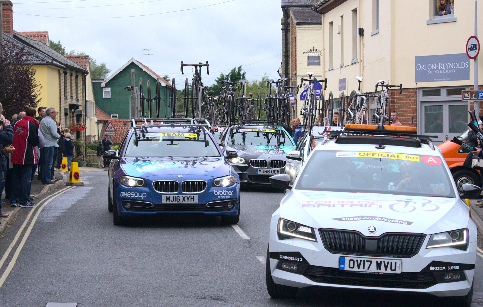 The first tranch of team cars piles through from The Tour of Britain Does Eye, Suffolk - 8th September 2017
