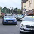 The first tranch of team cars piles through, The Tour of Britain Does Eye, Suffolk - 8th September 2017