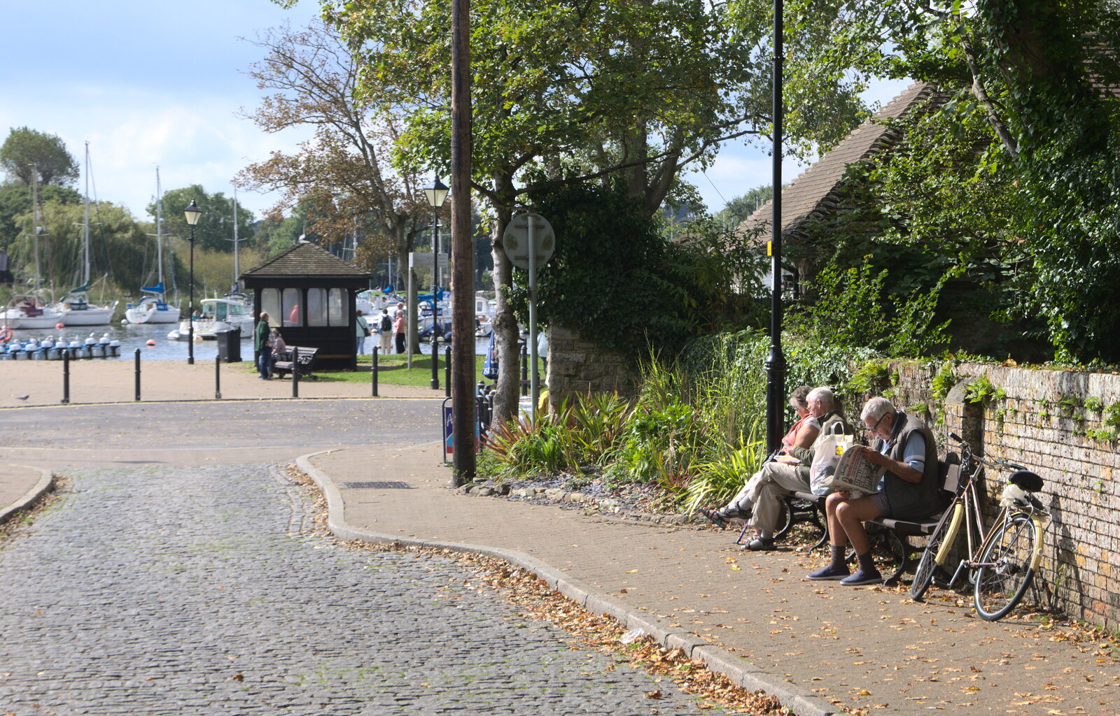 Someone reads the newspaper down by the quay from Grandmother's Wake, Winkton, Christchurch, Dorset - 18th September 2017