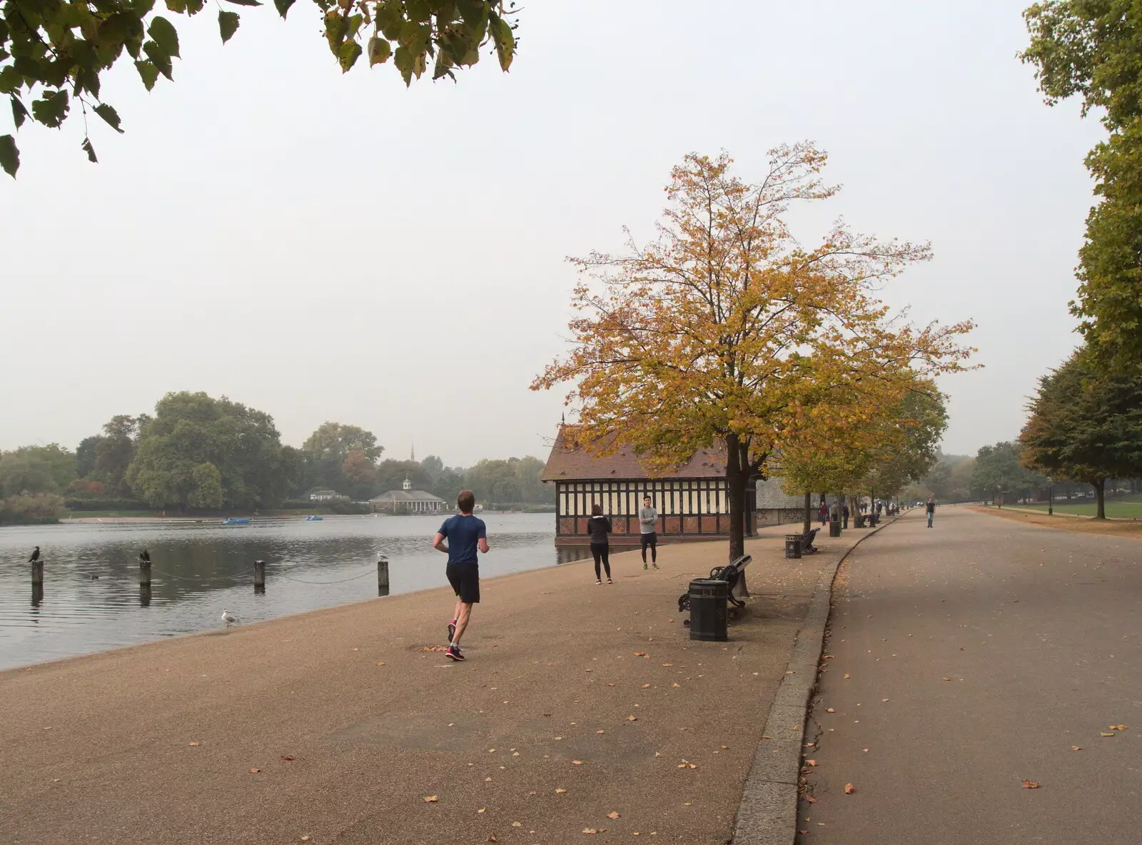 A jogger runs along the pavement, from Hyde Park and Carpets, London and Diss - 20th September 2017