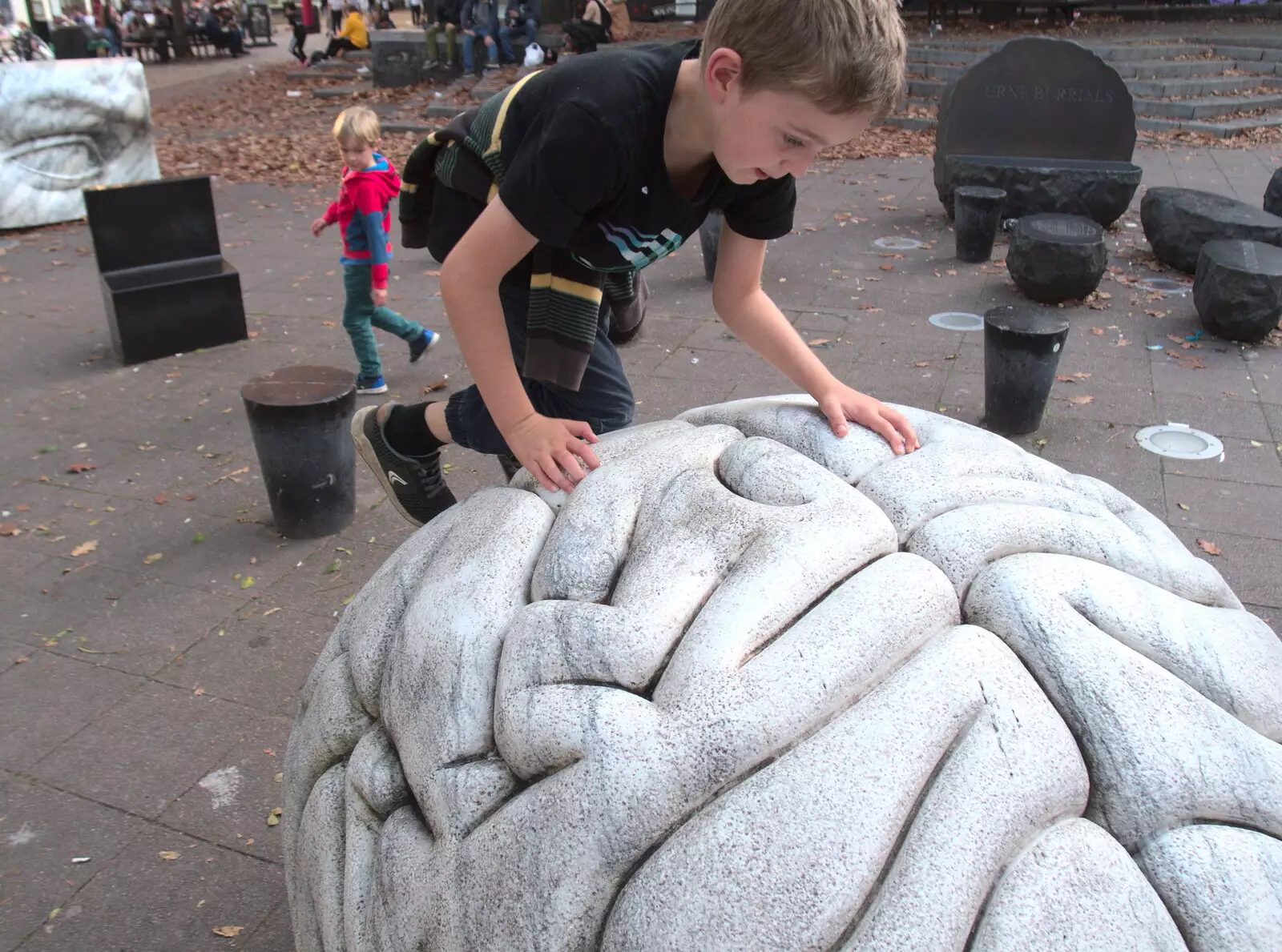 Fred climbs the granite brain on the Haymarket, from Trafalgar Day and Pizza, Norwich, Norfolk - 15th October 2017