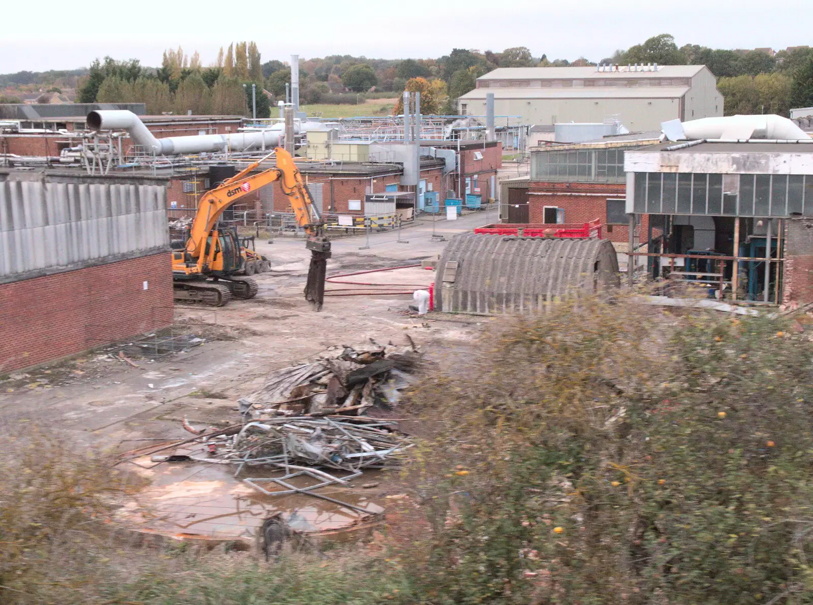 A digger breaks something up, from Trafalgar Day and Pizza, Norwich, Norfolk - 15th October 2017