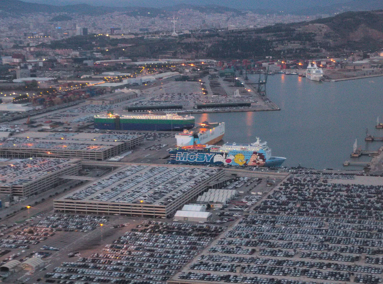 The plane's final approach is over the docks, from Barcelona and Parc Montjuïc, Catalonia, Spain - 21st October 2017