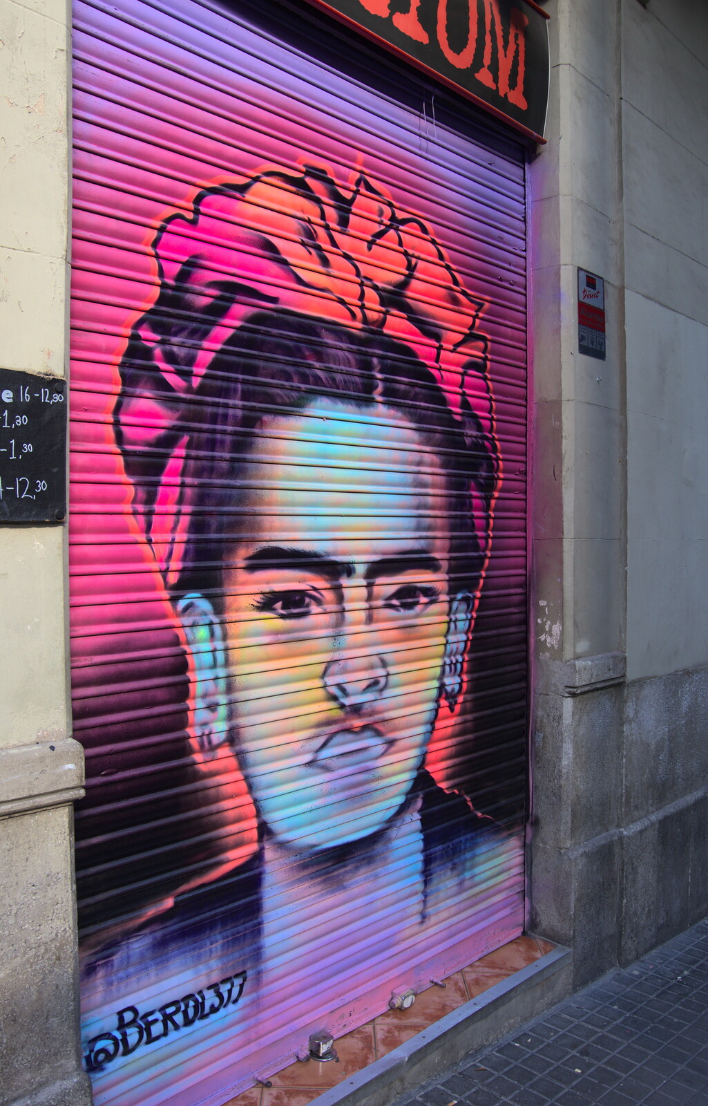 Street art on the shuttered door of Redrum from Barcelona and Parc Montjuïc, Catalonia, Spain - 21st October 2017