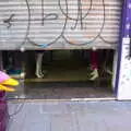 Mannequin legs stick out from behind a shutter , Barcelona and Parc Montjuïc, Catalonia, Spain - 21st October 2017