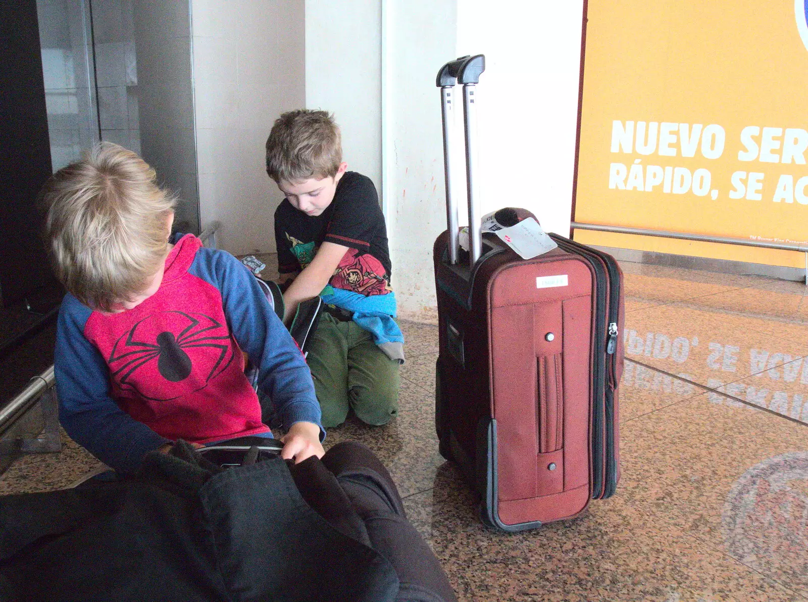 The boys on the airport floor, from A Barcelona Bus Tour, Catalonia, Spain - 25th October 2017