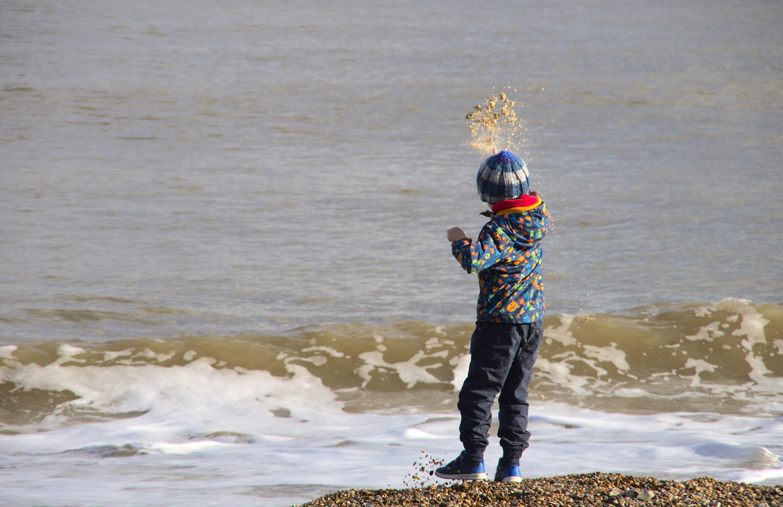 Harry flings sand at the sea from A Trip to the Amusements, Southwold Pier, Southwold, Suffolk - 5th November 2017