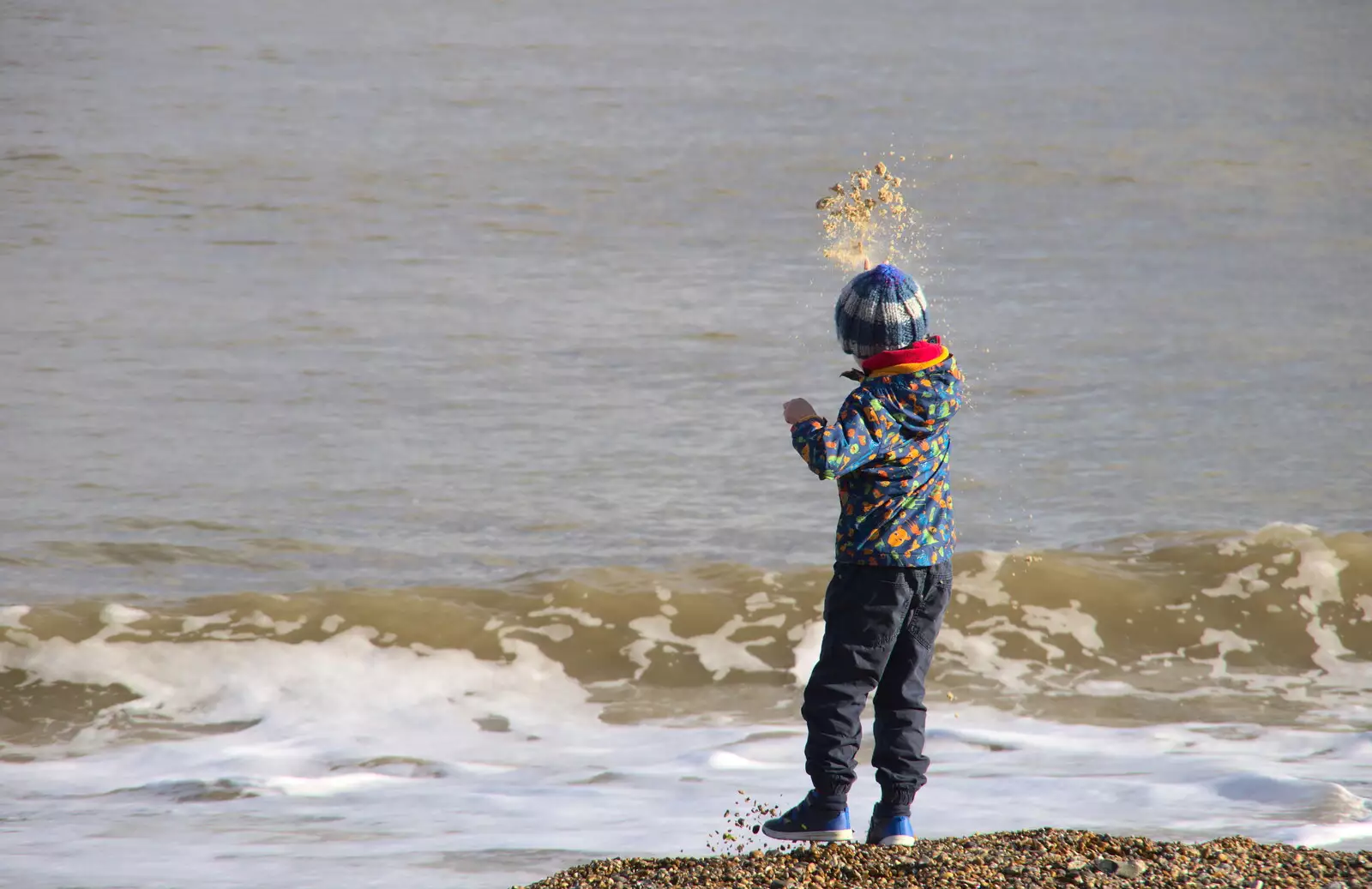 Harry flings sand at the sea, from A Trip to the Amusements, Southwold Pier, Southwold, Suffolk - 5th November 2017