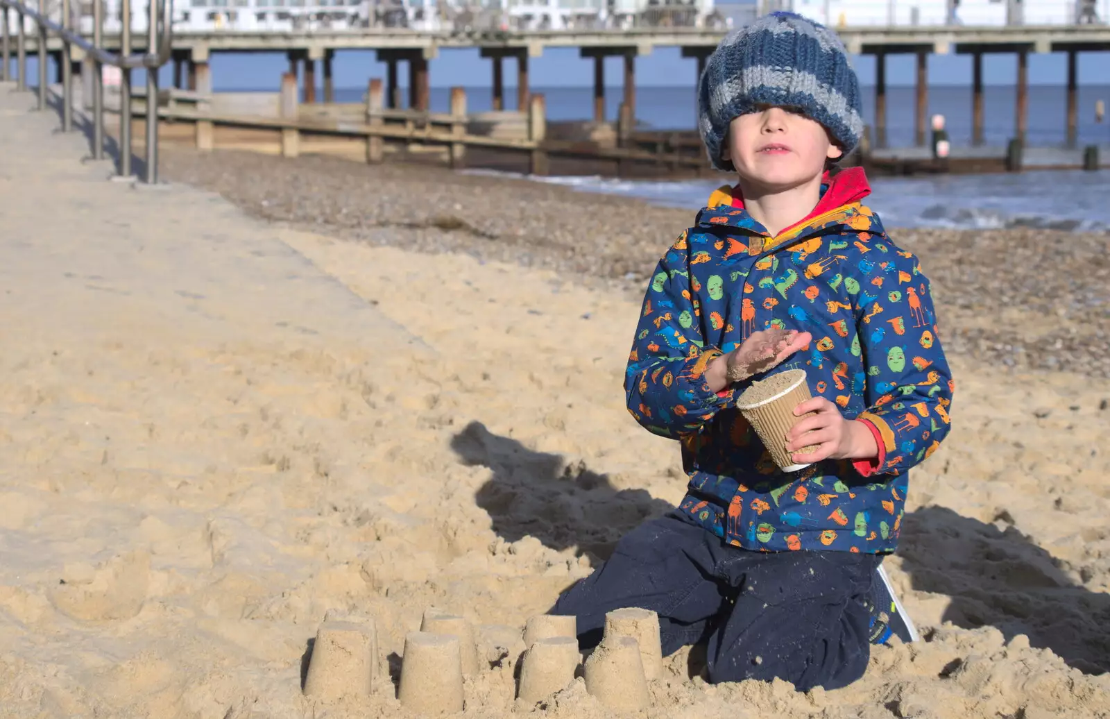 Harry looks up from his sandcastle building, from A Trip to the Amusements, Southwold Pier, Southwold, Suffolk - 5th November 2017