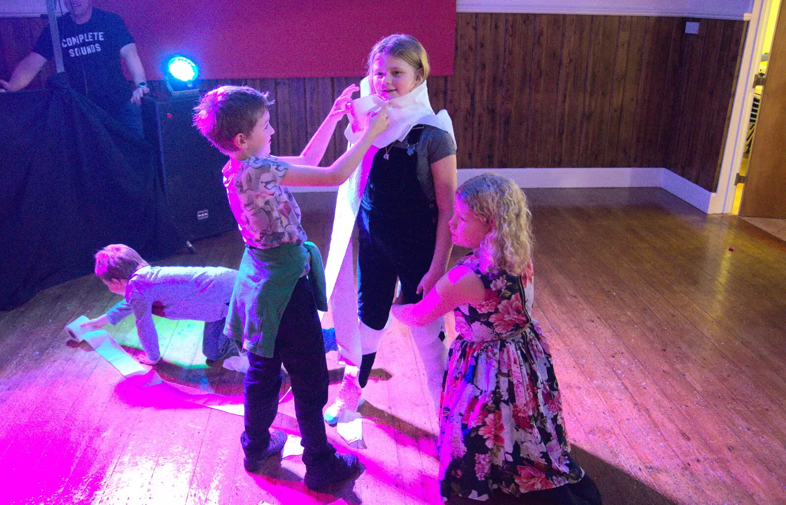 Oak and Fred make a mummy out of Jessica, from Bill's Birthday, The Lophams Village Hall, Norfolk - 9th December 2017