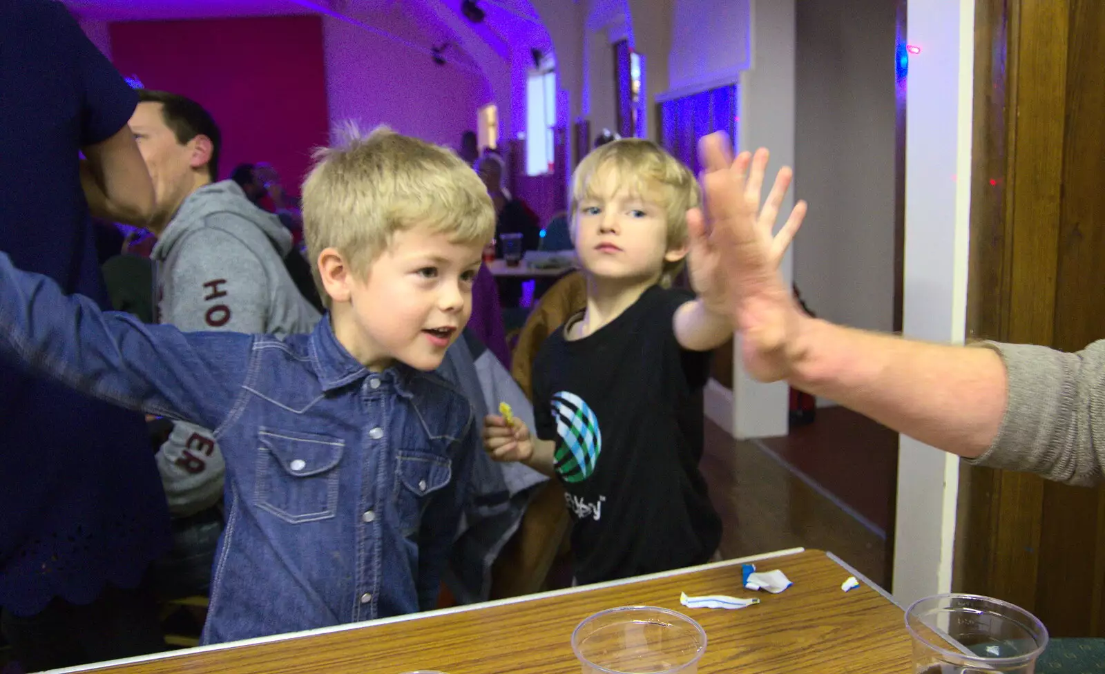 Jack and Harry do high-fives with Wavy, from Bill's Birthday, The Lophams Village Hall, Norfolk - 9th December 2017