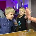 Jack and Harry do high-fives with Wavy, Bill's Birthday, The Lophams Village Hall, Norfolk - 9th December 2017