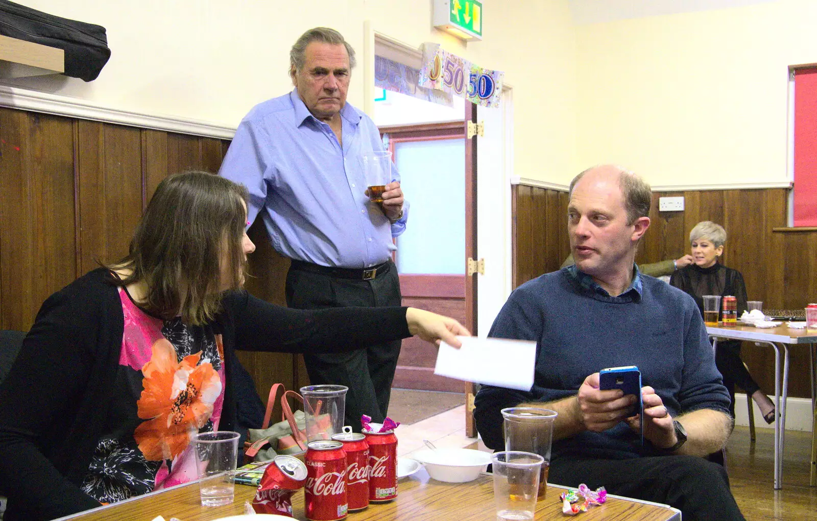 Claire waves around some paper as Big Al looks on, from Bill's Birthday, The Lophams Village Hall, Norfolk - 9th December 2017