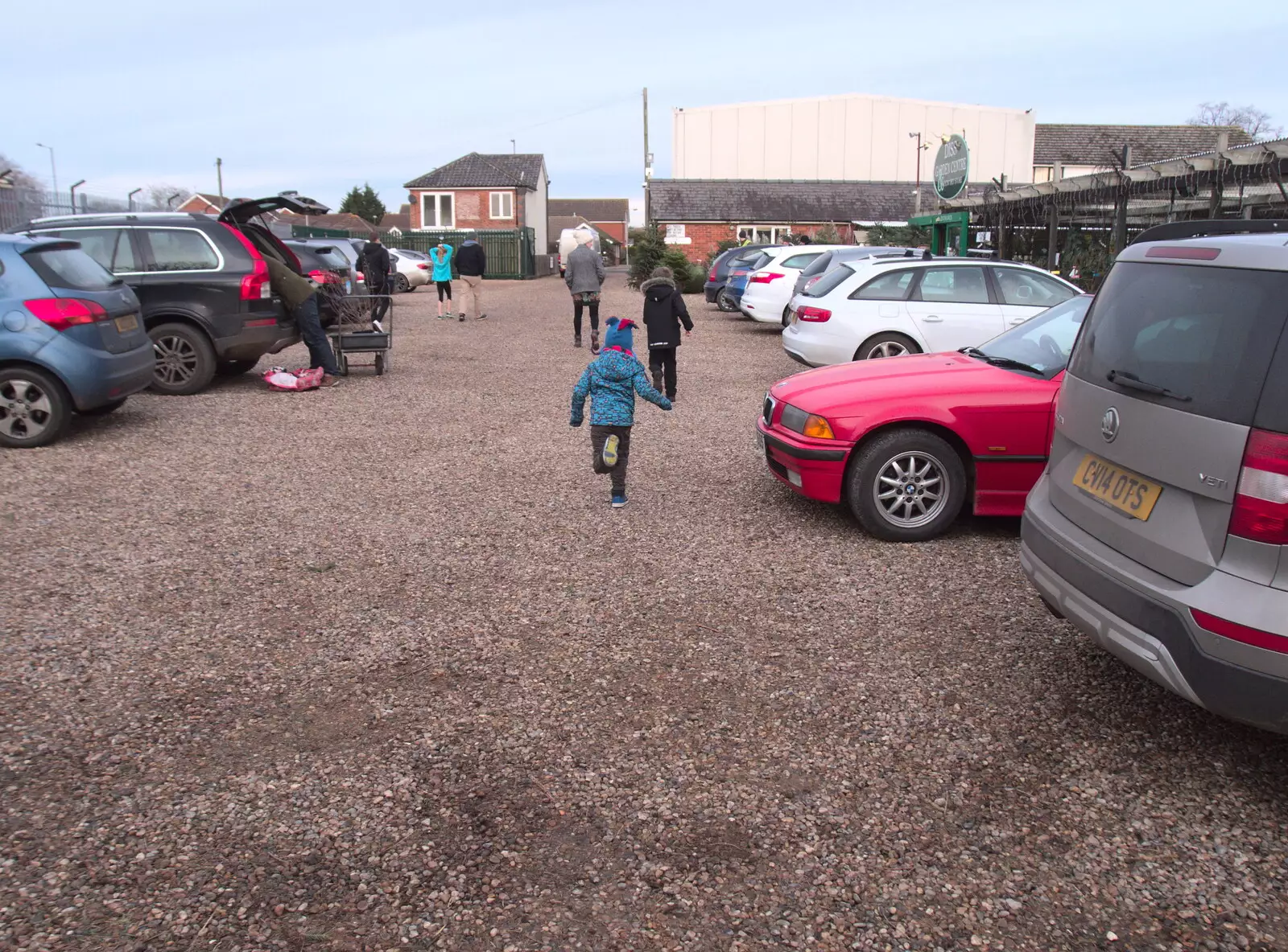 Harry runs off through the car park, from An Early Snow Day and the Christmas Tree, Brome, Suffolk - 10th December 2017