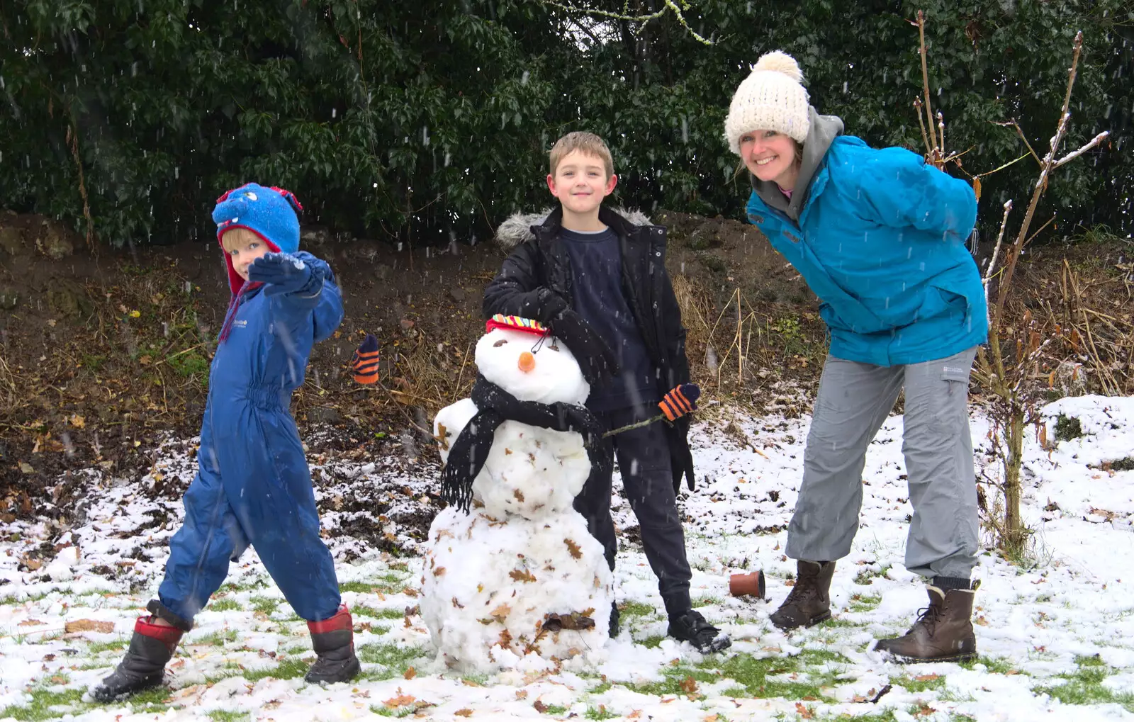 Isobel joins in with the snowman building, from An Early Snow Day and the Christmas Tree, Brome, Suffolk - 10th December 2017