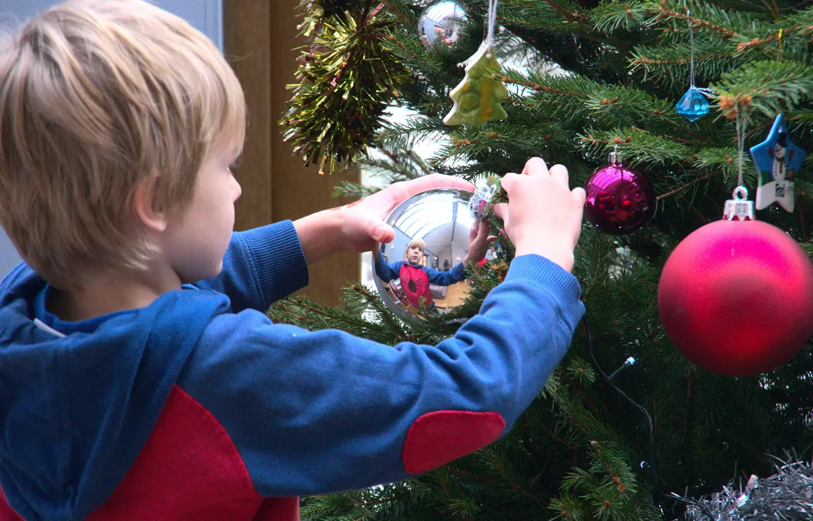 Harry's reflected in a big silver bauble, from An Early Snow Day and the Christmas Tree, Brome, Suffolk - 10th December 2017