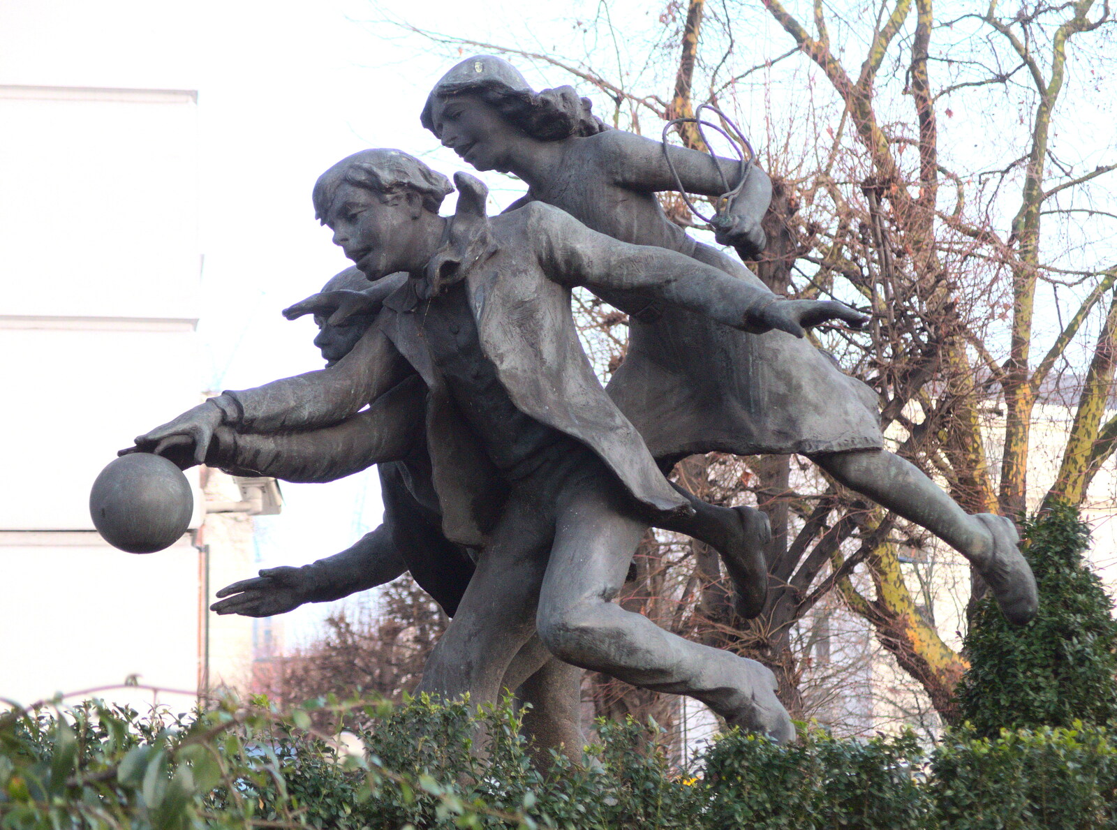 A statue of some children chasing a ball from A Work Lunch in Nandos, Bayswater Grove, West London - 20th December 2017