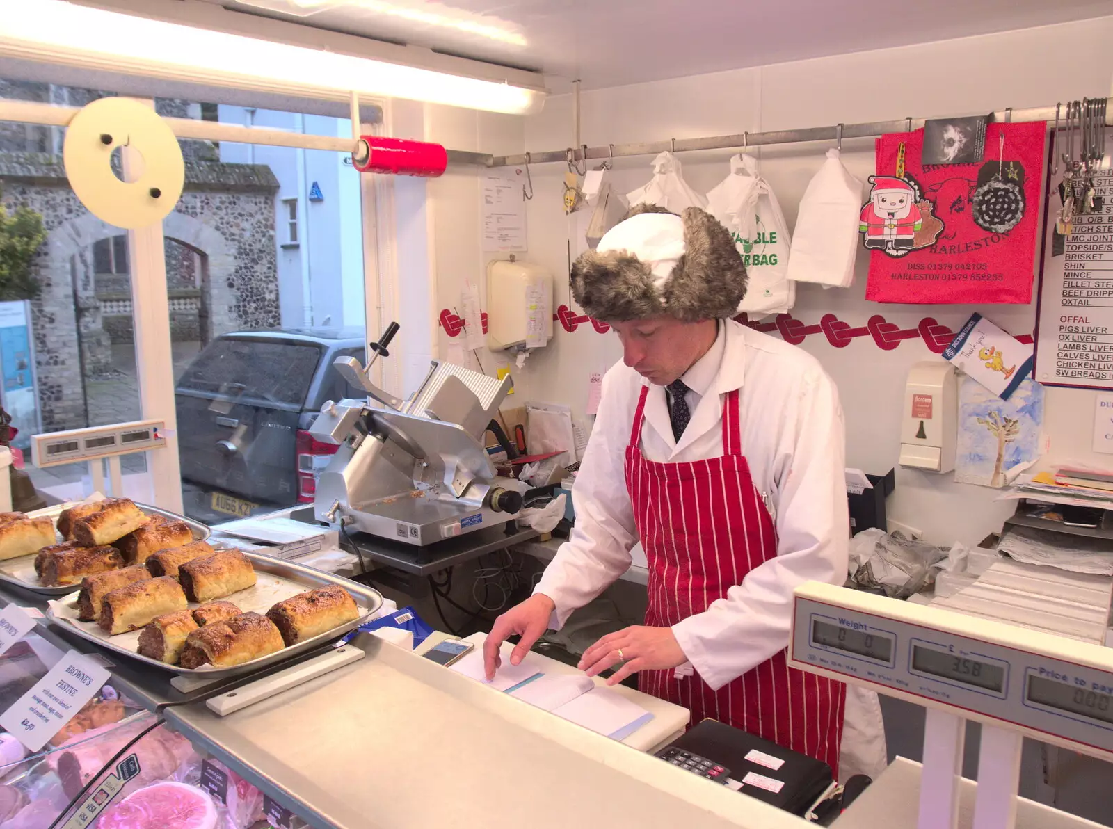 Dan Dan the Meat Man does some paperwork, from A Spot of Christmas Shopping, Norwich and Diss, Norfolk - 23rd December 2017