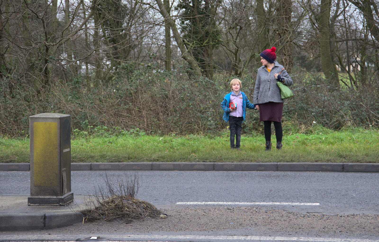 Harry and Isobel wait to cross the road from Christmas Day and The Swan Inn, Brome, Suffolk - 25th December 2017