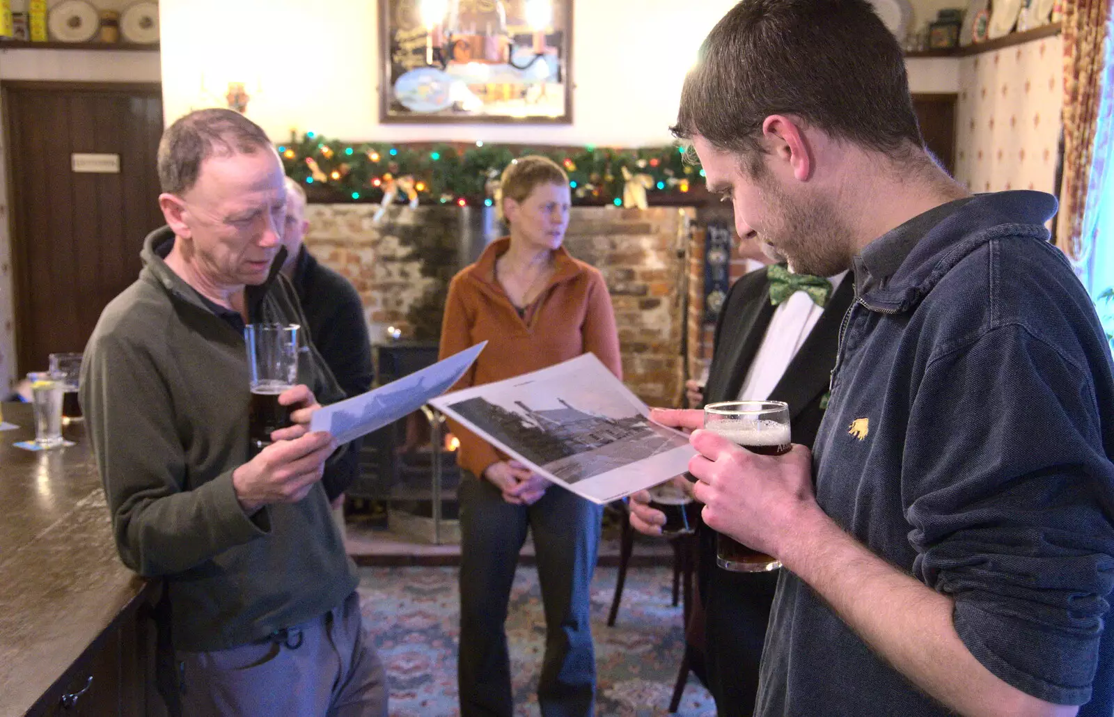 Apple and The Boy Phil look at some old pictures, from Christmas Day and The Swan Inn, Brome, Suffolk - 25th December 2017