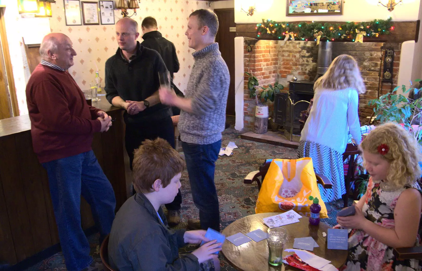 Fred and Rosie mess around with bar mats, from Christmas Day and The Swan Inn, Brome, Suffolk - 25th December 2017