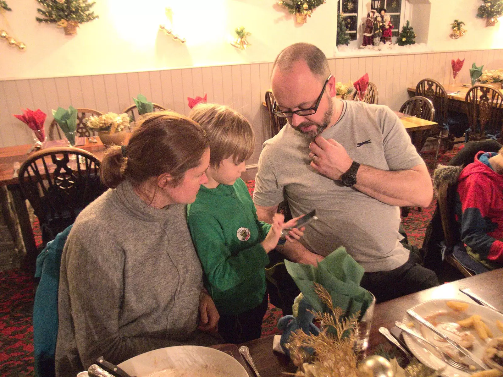 Matt looks over as Harry does something on a phone, from An End-of-Year Trip to Spreyton, Devon - 29th December 2017