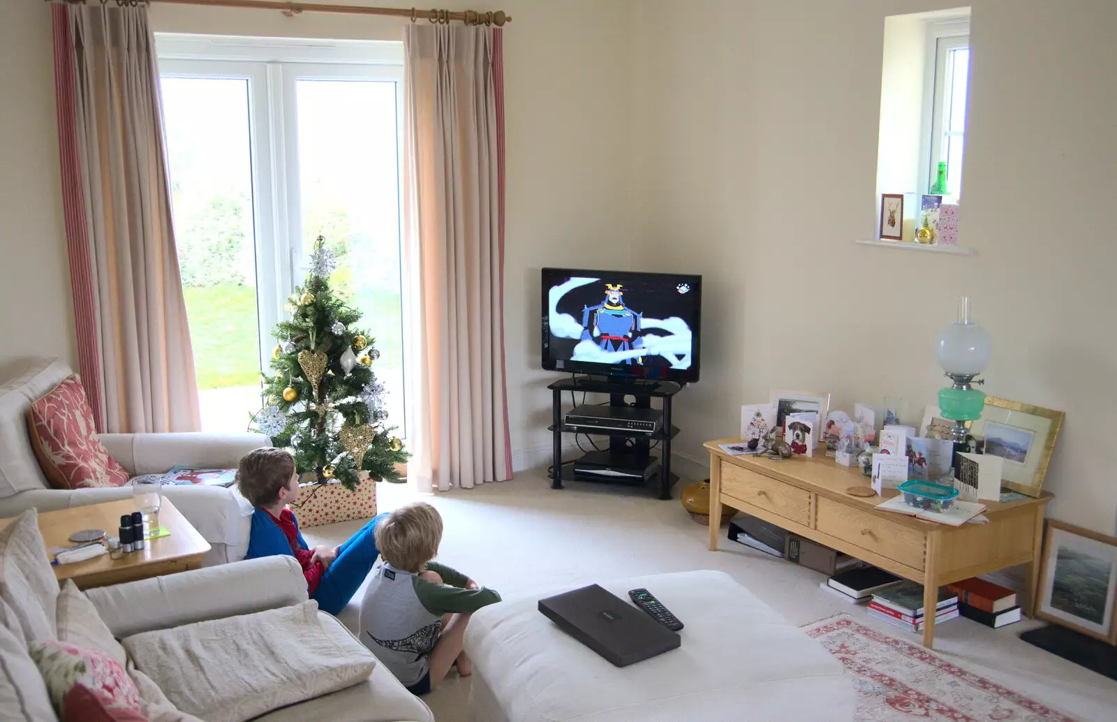 The boys watch some cartoon guff on Gradnma J's telly, from Killerton House, Broadclyst, Devon - 30th December 2017