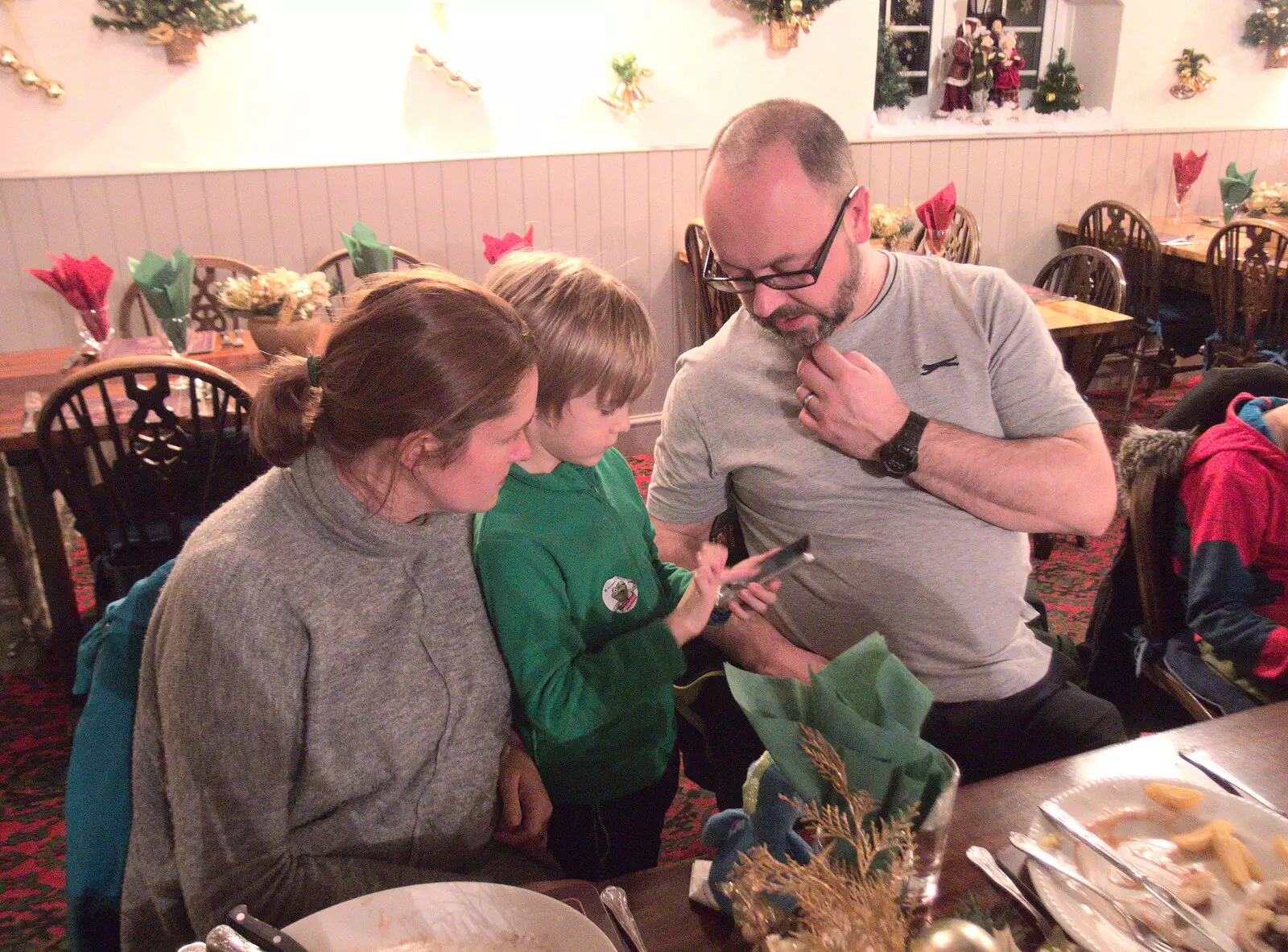 Matt looks over as Harry does something on a phone, from New Year's Eve in Spreyton, Devon - 31st December 2017