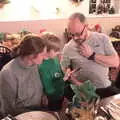 Matt looks over as Harry does something on a phone, New Year's Eve in Spreyton, Devon - 31st December 2017