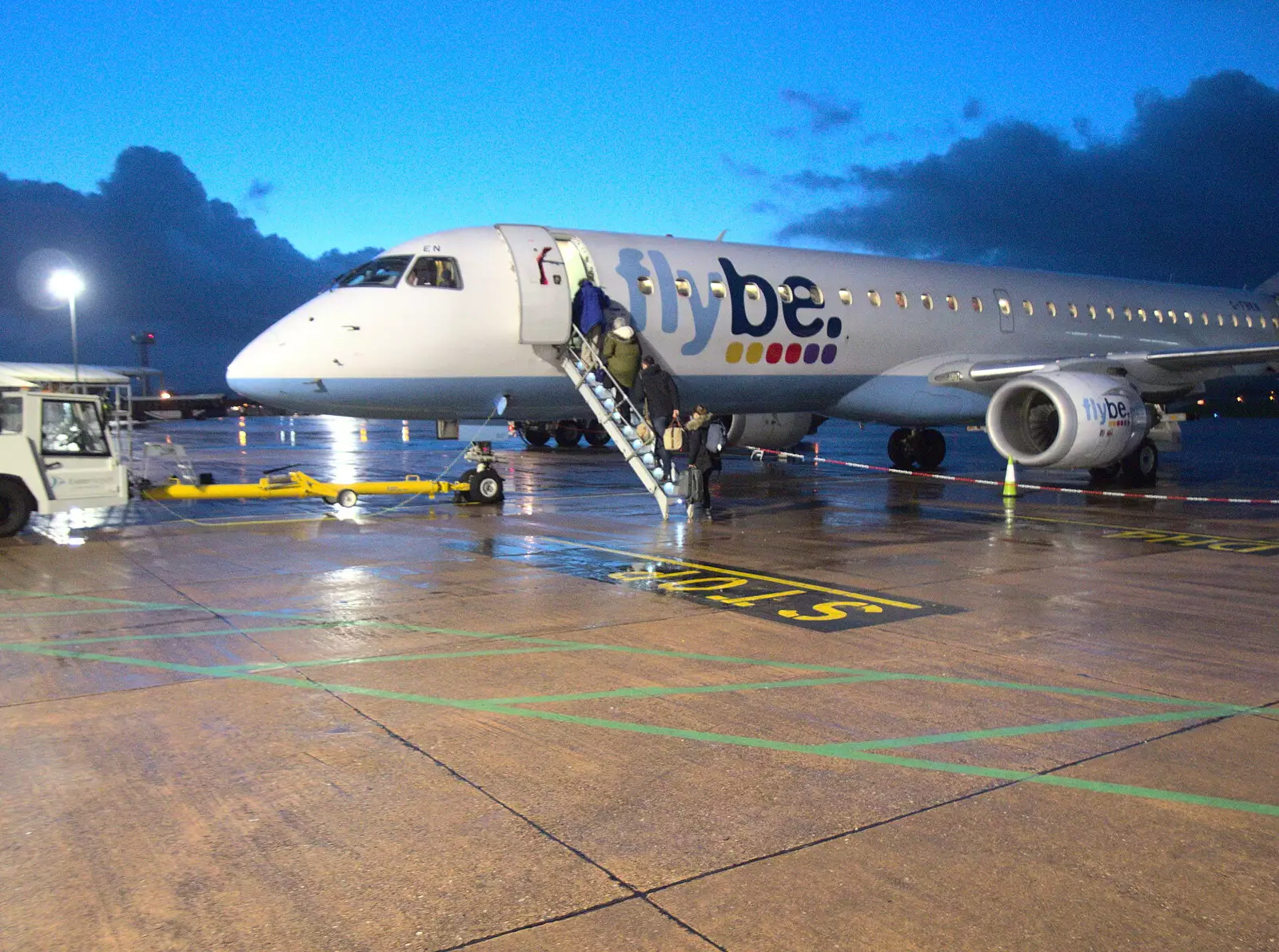 Passengers load up on the FlyBe Embraer, from New Year's Eve in Spreyton, Devon - 31st December 2017