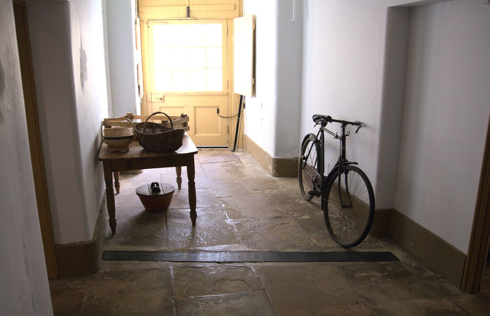 A 1920s bike leans on a wall from Life Below Stairs, Ickworth House, Horringer, Suffolk - 28th January 2018