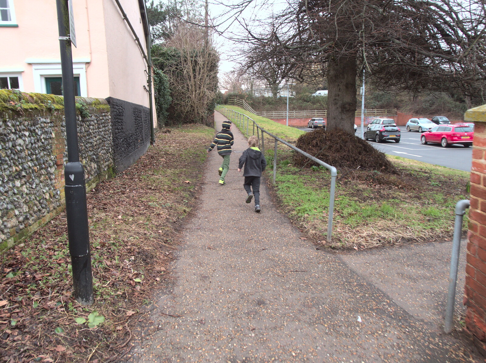 The boys run off up the hill past the surgery from Paddington Fire Alarms and Mere Moments Café, Diss, Norfolk - 2nd February 2018