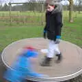 Harry's a blur as he spins the roundabout, A Return to Thornham Walks, Suffolk - 4th February 2018