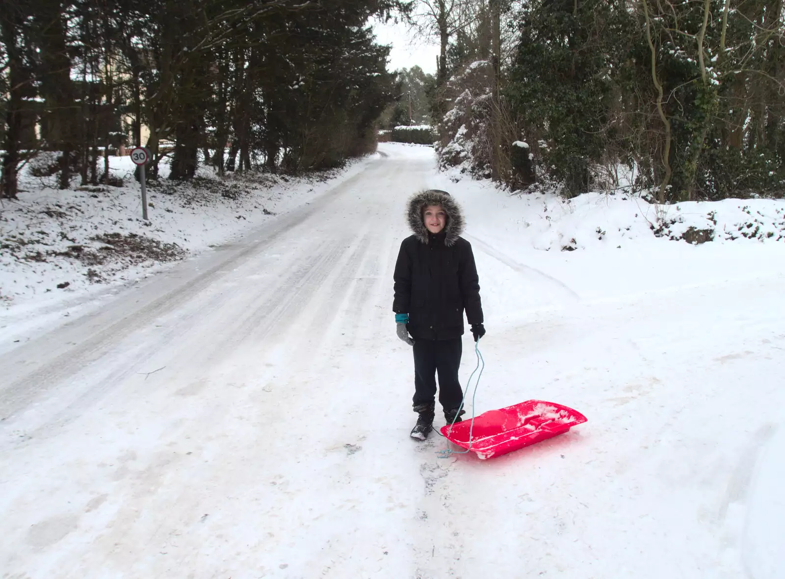 Fred outside the Oaksmere, with sledge at the ready, from More March Snow and a Postcard from Diss, Norfolk - 3rd March 2018