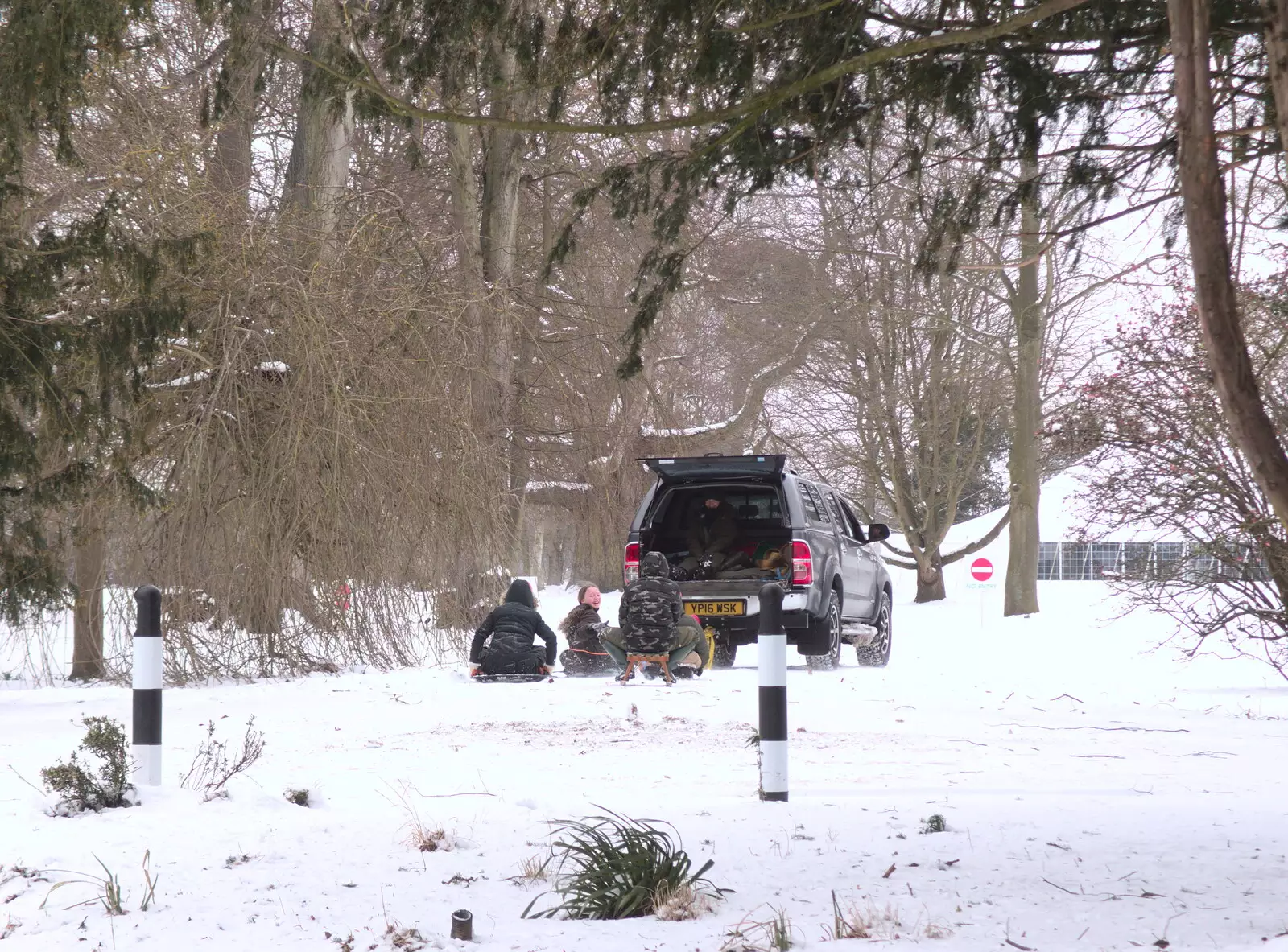 A bunch of kids are towed around by an SUV, from More March Snow and a Postcard from Diss, Norfolk - 3rd March 2018