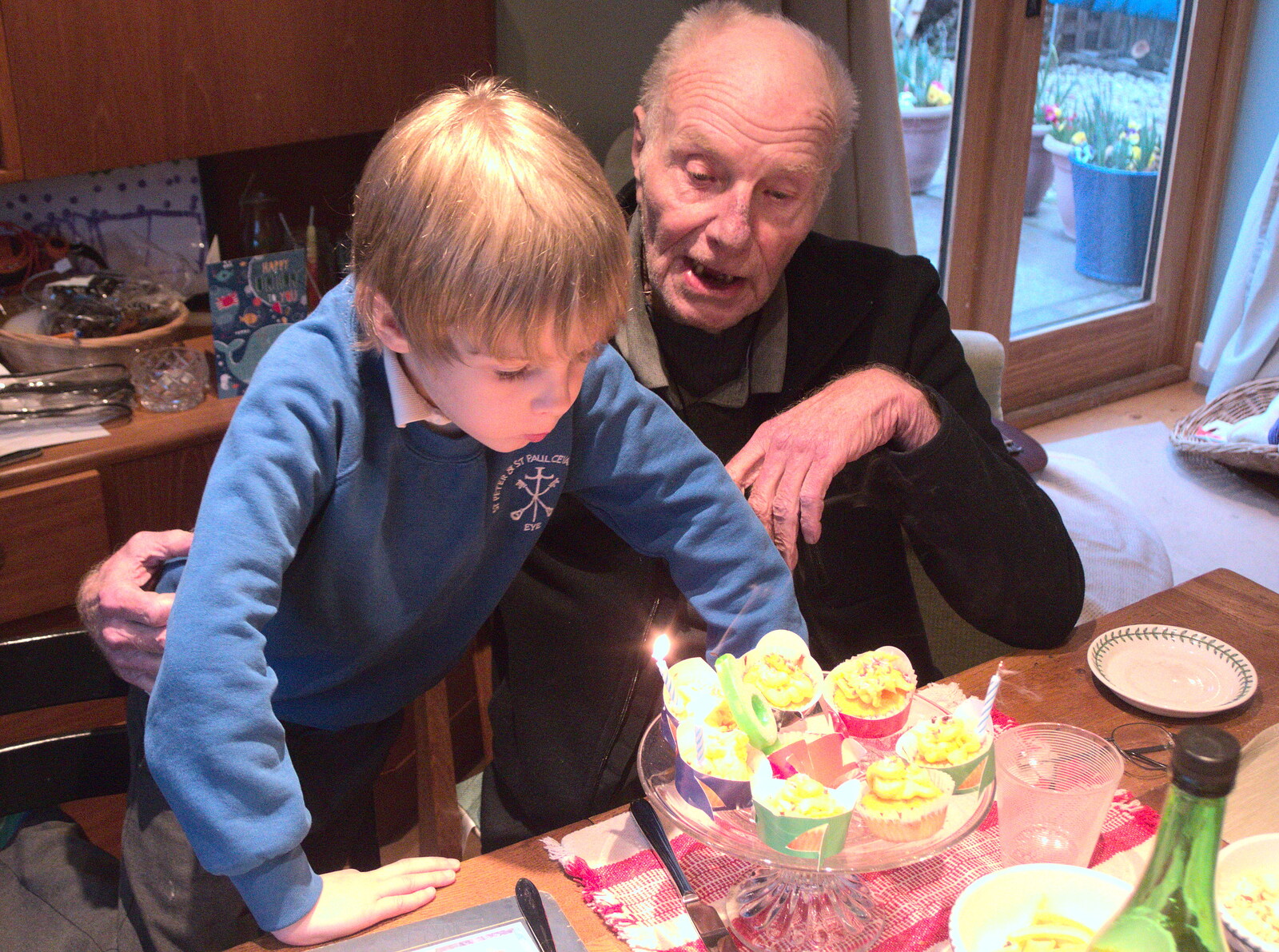 Harry blows his candles out as Grandad looks on from Trackside Graffiti, and Harry's Cake, London and Suffolk - 28th March 2018