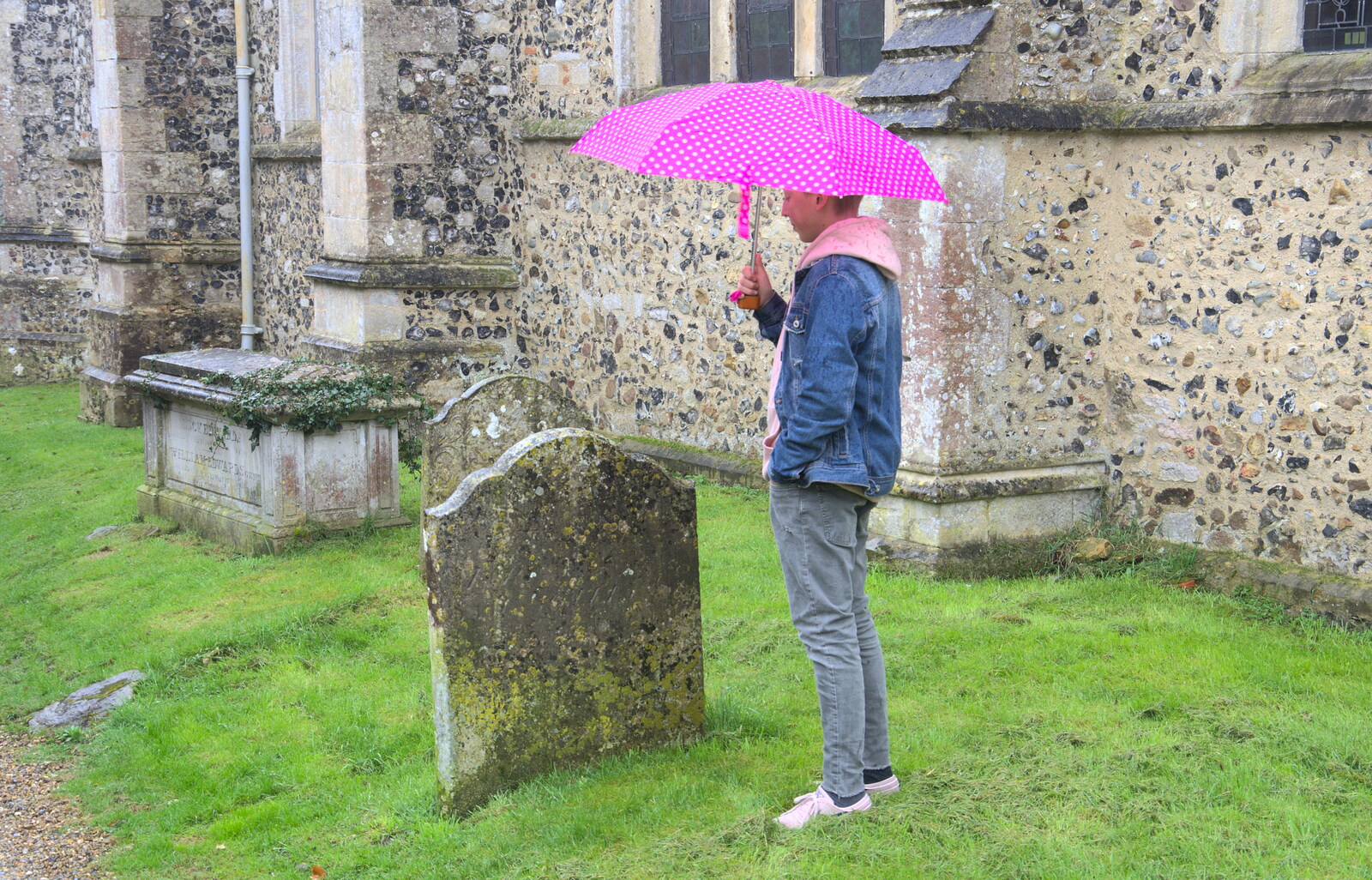 Kai waits under an umbrella from Darts at the Beaky, and a Visit From Brussels, Occold and Thorndon, Suffolk - 9th April 2018