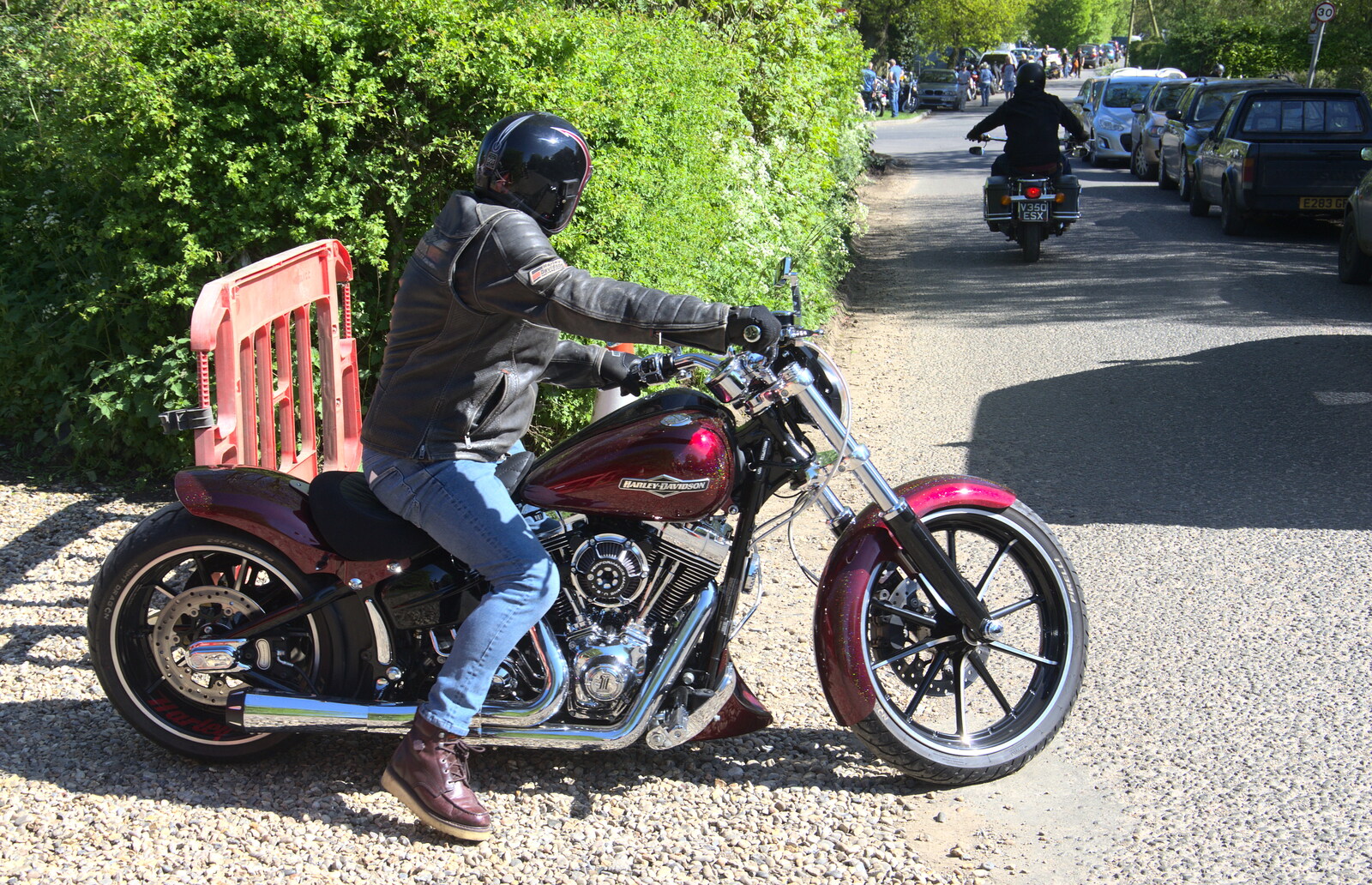 A biker on a Harley rides off from Beer, Bikes and Bands, Burston Crown, Burston, Norfolk - 6th May 2018