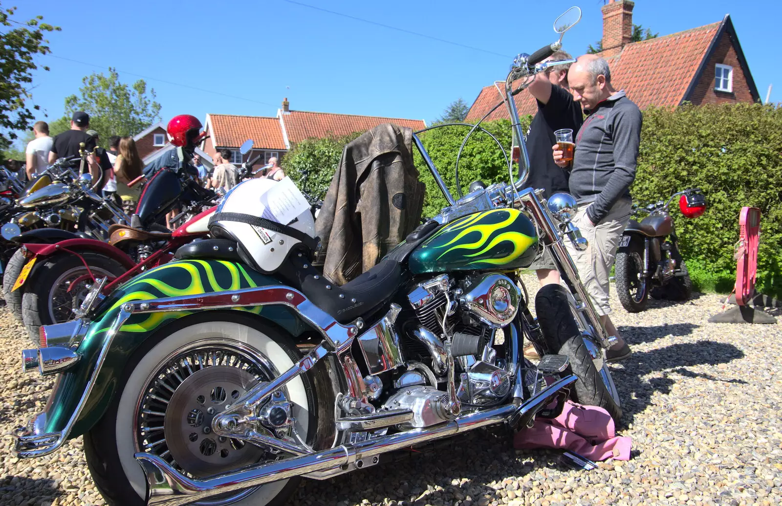 DH inspects a bike, from Beer, Bikes and Bands, Burston Crown, Burston, Norfolk - 6th May 2018