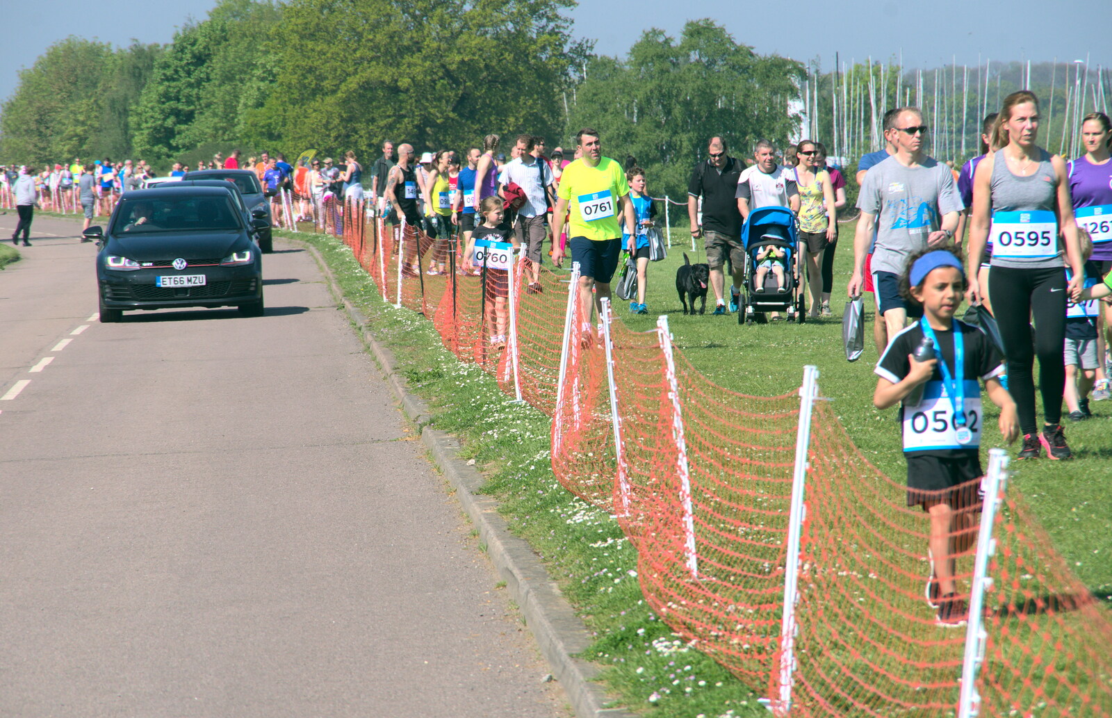 A stream of people heads down to registration from Isobel's 10km Run, Alton Water, Stutton, Suffolk - 6th May 2018