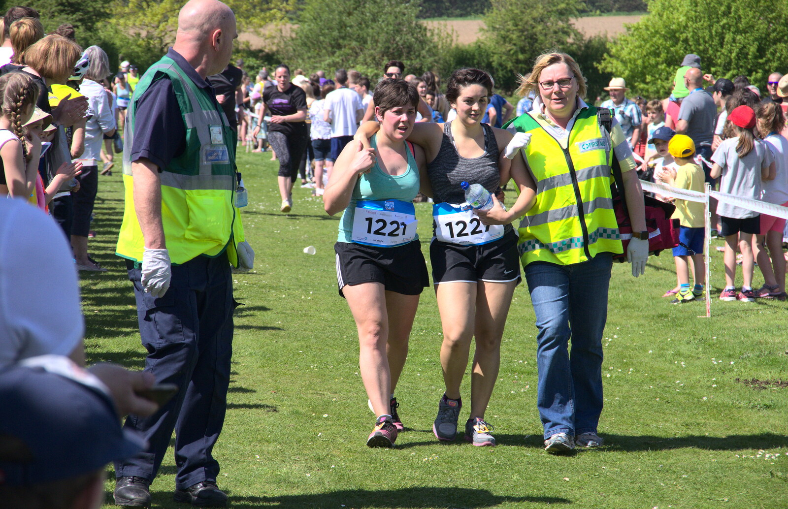 A runner gets a helping hand over the line from Isobel's 10km Run, Alton Water, Stutton, Suffolk - 6th May 2018