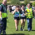 A runner gets a helping hand over the line, Isobel's 10km Run, Alton Water, Stutton, Suffolk - 6th May 2018